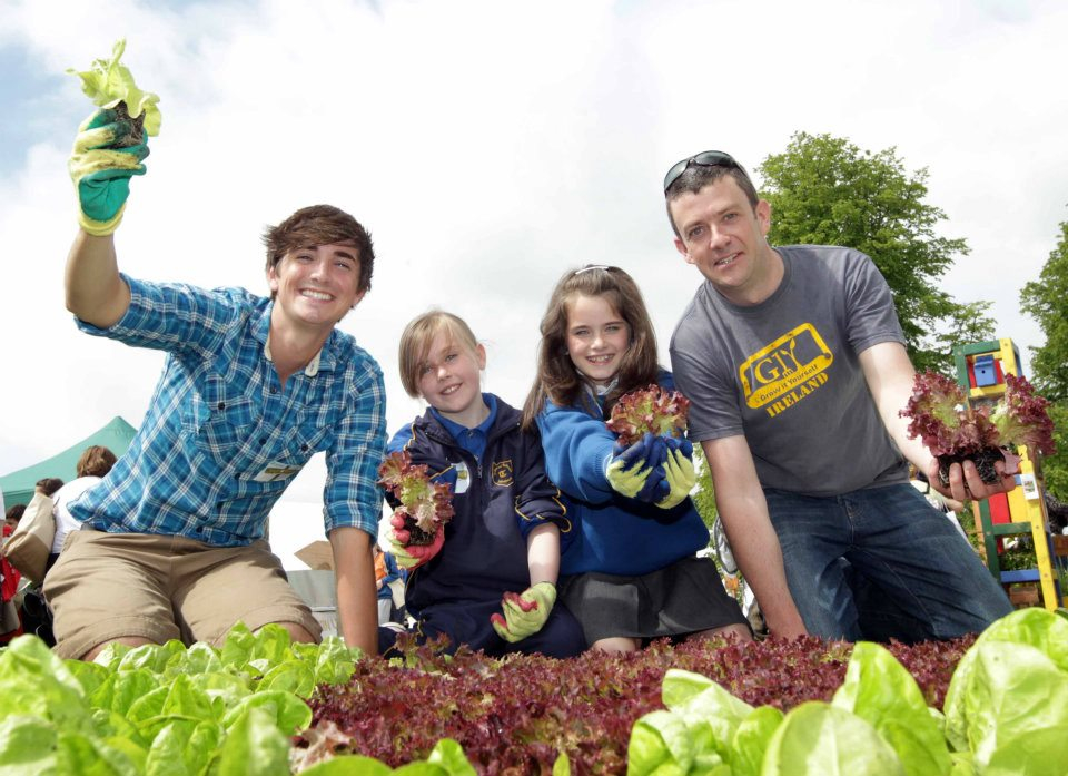 GIY founder Michael Kelly with celebrity chef Donal Skehan at Bloom in 2012 with kids from St Thomas's Senior school in Tallaght, winners of the 2012 innocent GIY Sow & Grow campaign